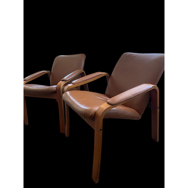 Vintage angled Ekorne Attributed chairs. Very cool approximately 30% angled, so comfortable! Featuring curved teak arms,...