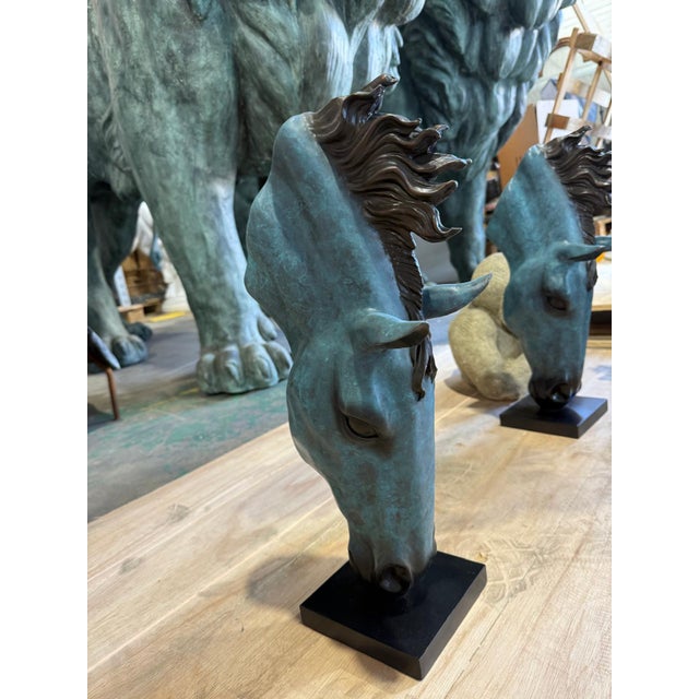 Powerful and poetic, this sculptural bronze horse head presents a dynamic study in movement and form. The head gracefully...