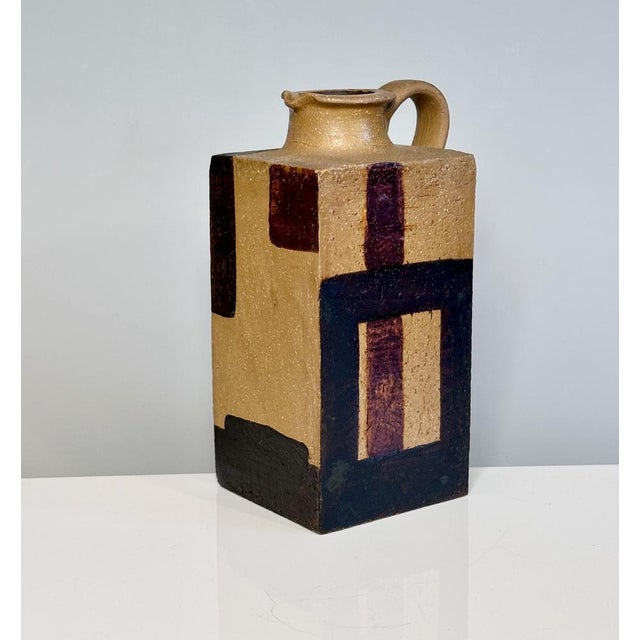A sculptural cubic-shaped studio ceramic art jug with an impressive abstract modern decor, created in Germany during the...