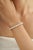 This Carat&Her Mid-20th Century Pearl Line Bracelet showcases a refined row of luminous round pearls, creating a timeless...