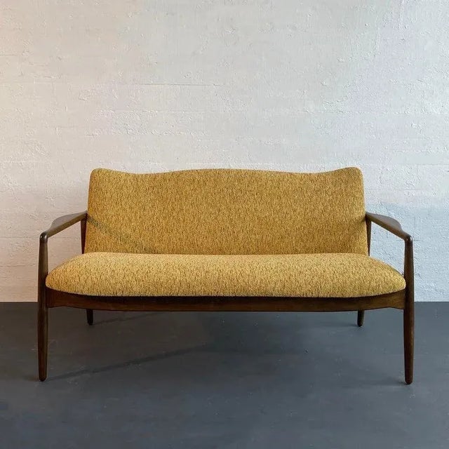 This traditional Danish modern sofa was designed in the mid 20th century by American designer William Watting who left the...