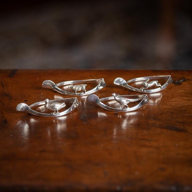 Antique 20th Century stunning set of four solid silver 'lucky animals' napkin rings. Each napkin holder is in a shape of a...