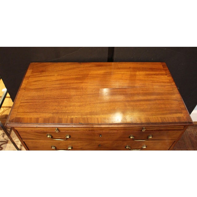 Circa 1770 George III bachelor's chest with slide, likely Scottish. Warm, faded brown mahogany front; richer colored...
