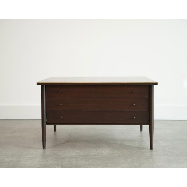 An elegant expression of Mid-Century Modern design, this refined end table by Paul McCobb, circa 1950s, showcases the...