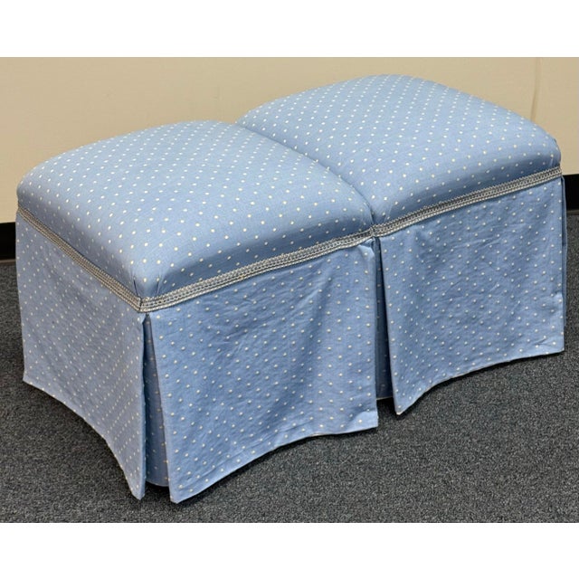 Charming pair of matching ottomans upholstered in soft blue fabric with a delicate cream dotted pattern. Each features a...