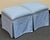 Charming pair of matching ottomans upholstered in soft blue fabric with a delicate cream dotted pattern. Each features a...