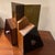 Super cool Smokey lucite wood bookends held together with large chrome Cartier style screws.
