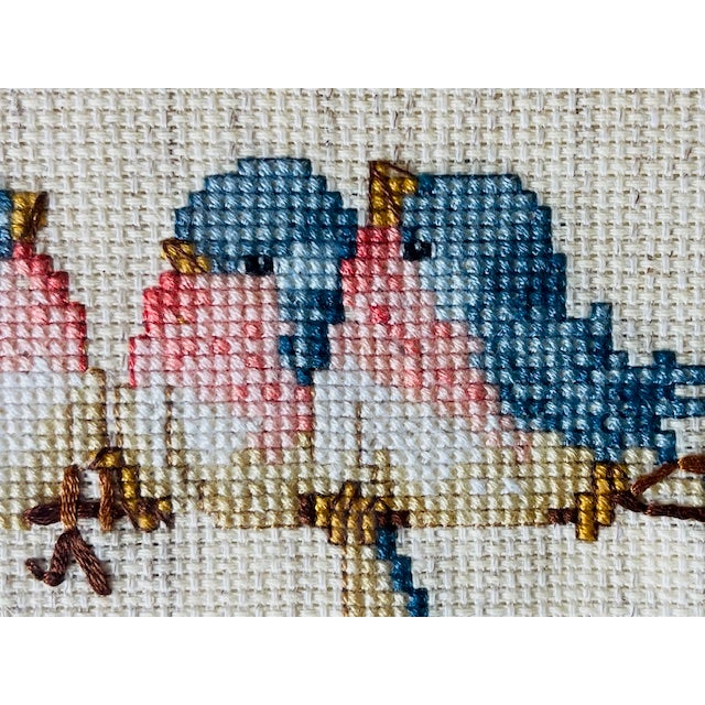 Delightful framed vintage real needlepoint of a gathering of fanciful, colorful birds on a natural cream linen background....