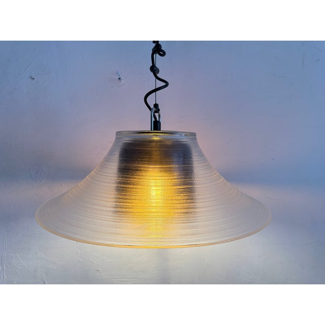 One pendant lamp from the 1970s/80s by Peill & Putzler, single-bulb, E27 socket. Two nested glass shades (the smaller...