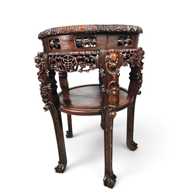 Description: Companion pair of elaborately carved Chinese jardinière or display stands, attributed to the Cantonese...