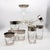 An iconic mid-century barware set by Dorothy Thorpe, featuring her signature silver band overlay on clear glass. This...