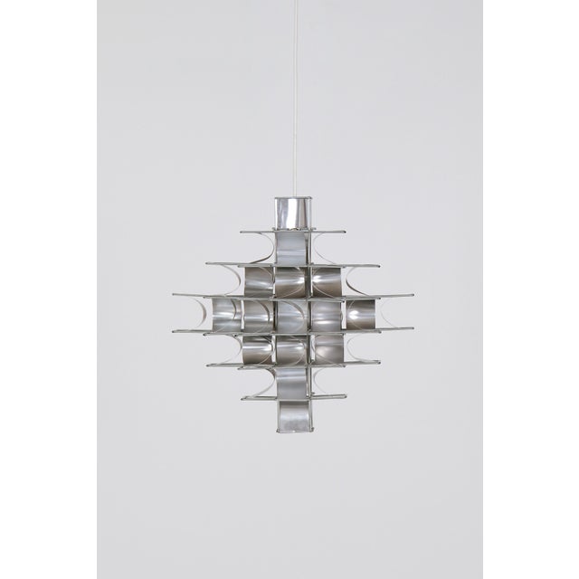 A 'Cassiopée' (Cassiopeia) pendant lamp designed by French designer Max Sauze around 1970 and manufactured in his own...