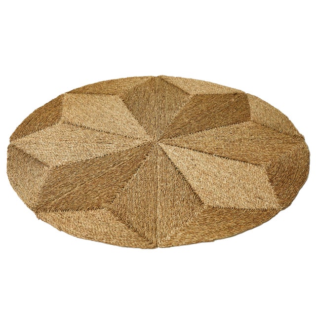 Comprised of interwoven diamonds, this product is the "sister rug" to our Rush House Original rug. The circular textile is...