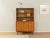 Puristic two-piece chest of drawers from the 1950s. High-quality body in walnut veneer with two sliding doors, three...
