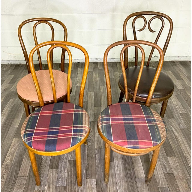 This is a gorgeous set of four assorted vintage Thonet style bentwood dining chairs or occasional chairs. Two matching...