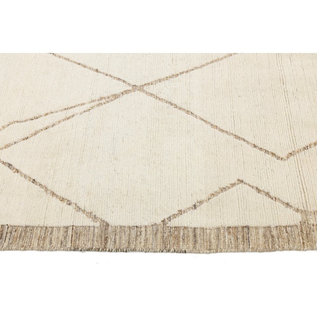 Elevate your space with this Modern Moroccan-inspired wool rug, blending centuries-old weaving traditions with a...