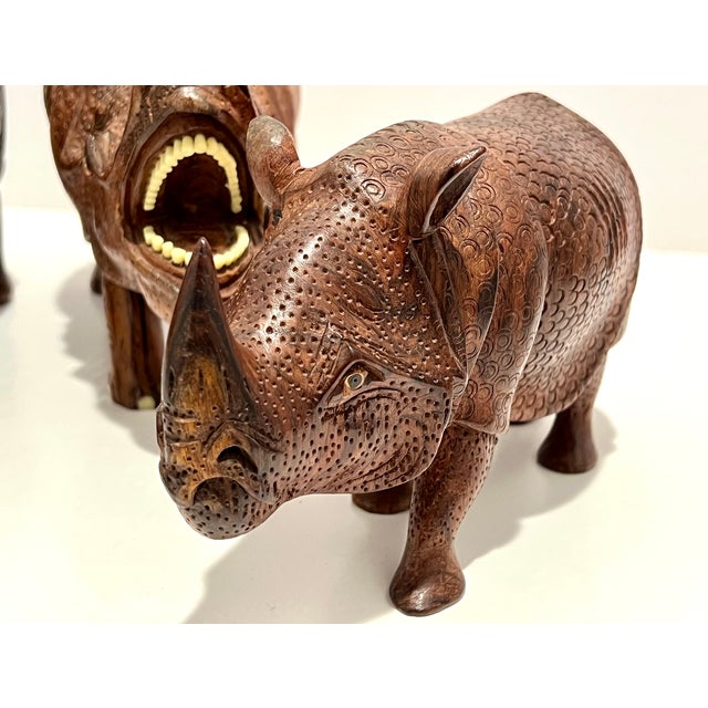 Set of 3 Hand-Carved Solid Wood Rhinoceros Sculptures, Textured Hide, Inlaid Teeth And Toenails Striking set of three...