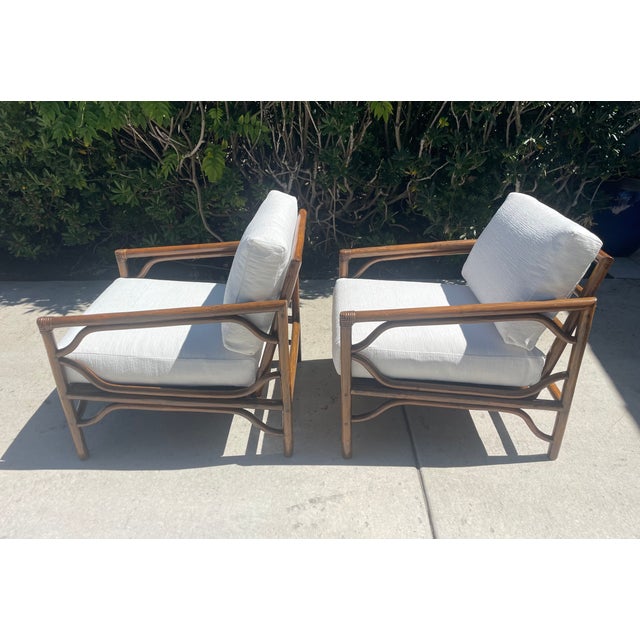 Rare vintage rattan lounge chairs from high-end brand Brown Jordan. This mid-century style set is crafted from thick...
