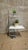 A minimalist vintage flower stand from Czechoslovakia, featuring a tubular chrome-plated steel frame, two white...