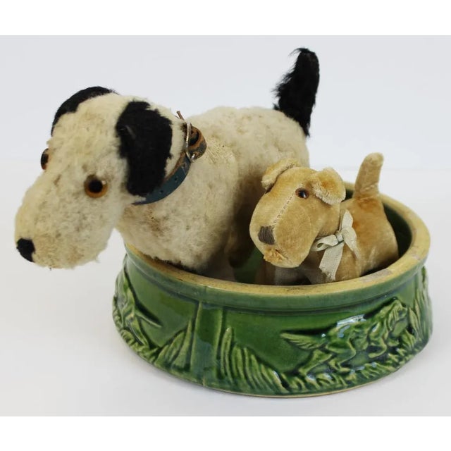 Two Steiff Dogs with Dog Bowl. Diameter of Dog Bowl: 7"D Height of Large Dog: 6 1/2"H Height of Small Dog: 4 1/2"H