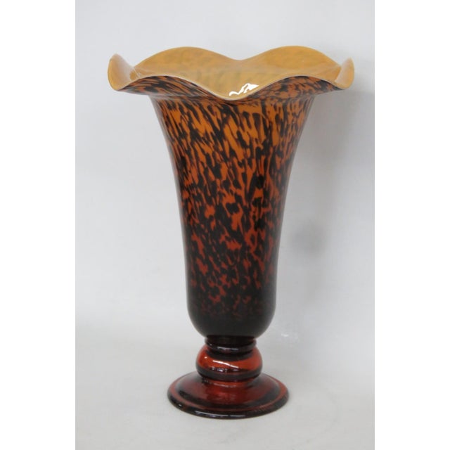 This beautiful Ruffled Pedestal Vase is made of glass. This stunning Italian style vase presents a gorgeous tortoiseshell...