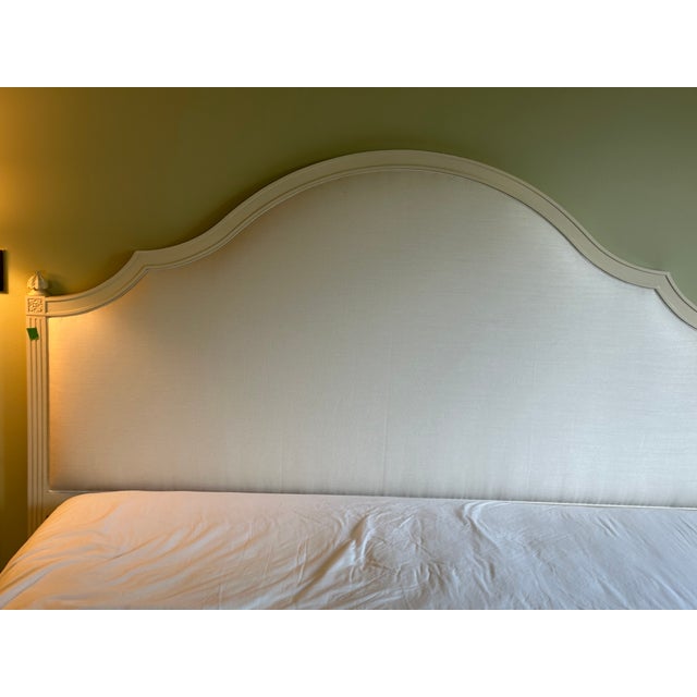 Classic French-inspired bonnet top headboard, hand carved rosette, fluted wood carving and fully upholstered footboard,...