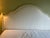 Classic French-inspired bonnet top headboard, hand carved rosette, fluted wood carving and fully upholstered footboard,...