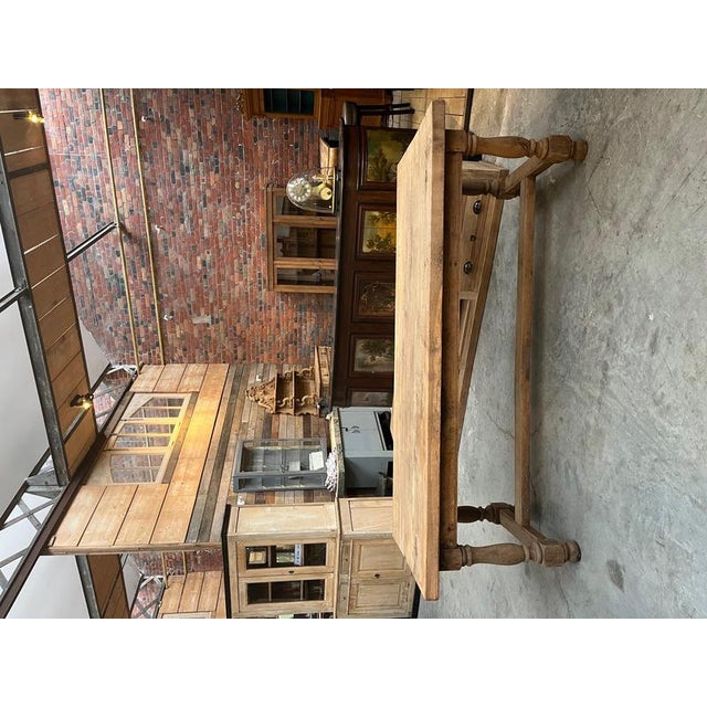 This antique solid oak farmhouse table has been fully restored. It has a 47 cm extension and a functional drawer. Height...