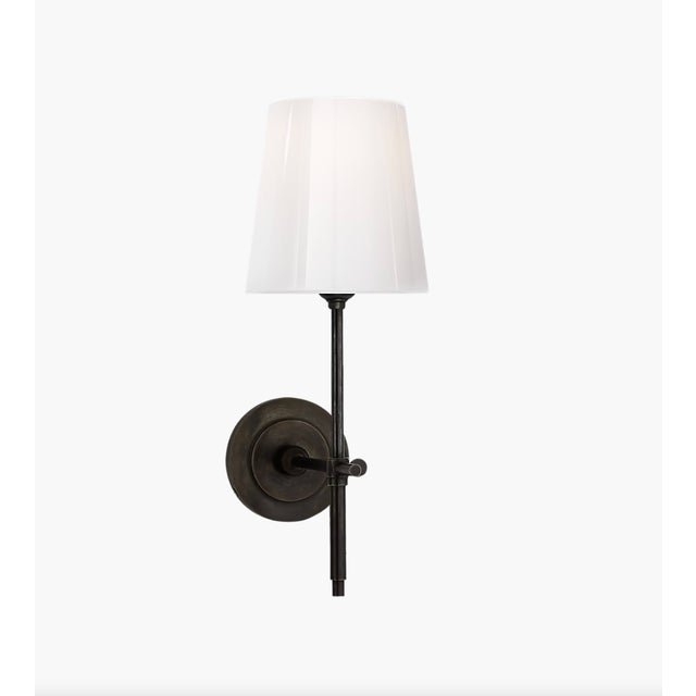 Pair of Visual Comfort Bryant Glass Sconce in black with tapered white glass shades; round backplate with thumbscrew...
