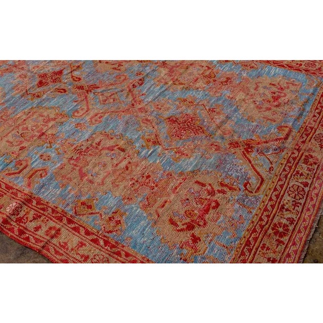 An early 20th century sky blue turkish oushak rug