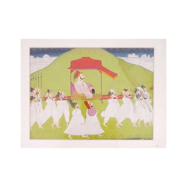 An antique late 18th century Indian miniature painting with a traditional scene of social life. In the center of the...