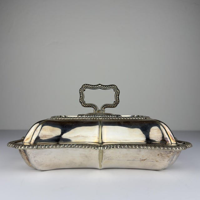 Antique silver plated serving dish and cover with gadrooned decoration and removable handle. Made in Sheffield, England,...
