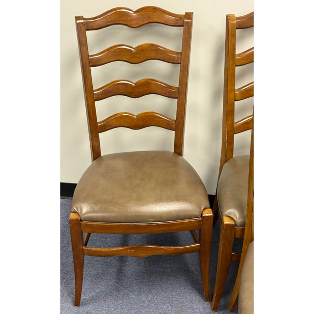 Beautiful set of French country chairs by Ethan Allen. Features solid wood construction, splayed legs, Ladderback...