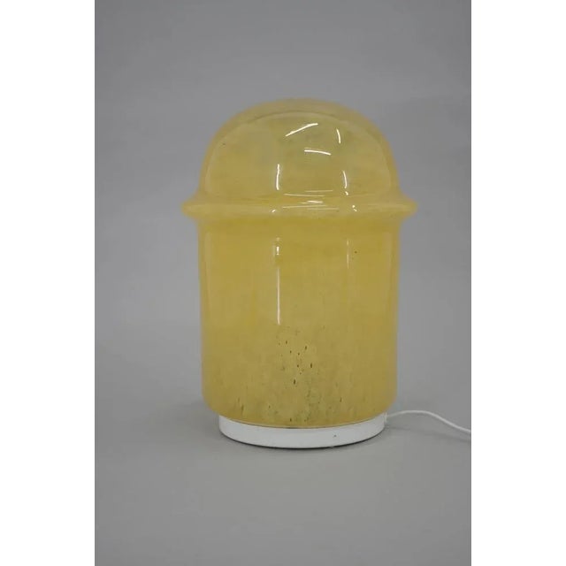 Space Age yellow glass table or floor lamp made in Czechoslovakia in 1970s. One crack on bottom part of glass (visible on...