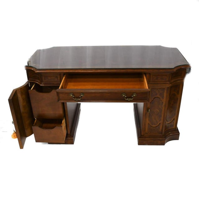 A Thomasville Walnut and Burlwood Inlaid Desk with Bookcase Compartment is an elegant, functional piece made from rich...
