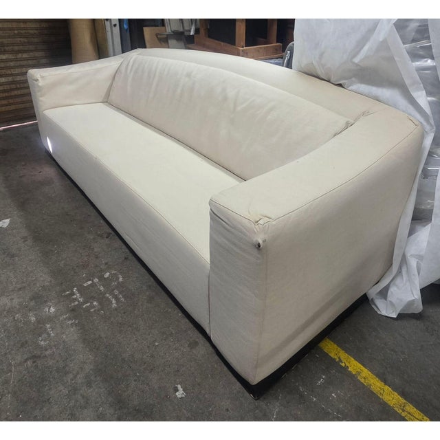This Armani Casa 3-seat sofa features a clean, modern design with cream upholstery. The sofa provides plenty of space for...