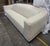 This Armani Casa 3-seat sofa features a clean, modern design with cream upholstery. The sofa provides plenty of space for...