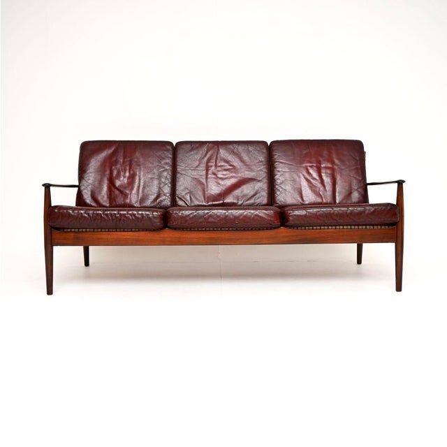 A very rare and absolutely stunning Danish vintage leather sofa by Grete Jalk for France and Son. It was made in Denmark,...