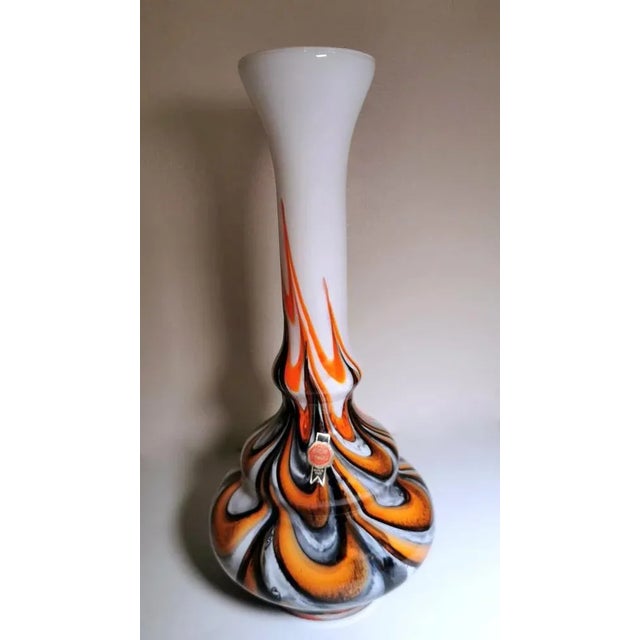 Wear consistent with age and use. The vase is in excellent condition, what may appear to be small defects inside or...