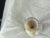 Blown glass vase with serrated neck, marbled white with gold inclusions. This magnificent vase is a piece of art that can...