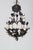 A pair of metal floral Italian chandeliers painted black with white painted metal flowers. It has five chandelier size...