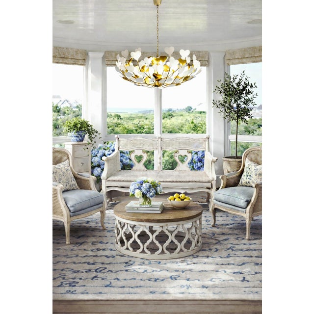 This exquisite Rustic French Country Settee showcases a gracefully scalloped camelback top rail, elegantly joined with a...