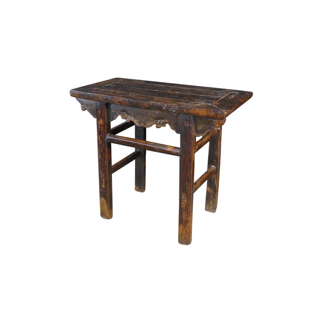 Mid-century Chinese elm altar table. Showcasing a compact, provincial silhouette rich in rustic character. The rectangular...