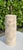 Vintage Curtis table lamp with a heavily textured, aged finish in warm ivory and cream. The body features a plaster-like...