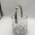 This is a lovely, light catching cut crystal ice bucket with deep swirl cuts in the glass. Made by Mikasa in the Olympus...