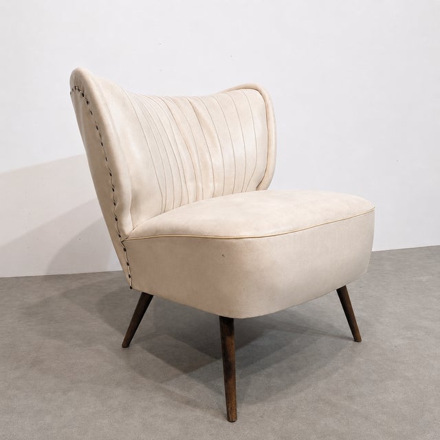 Lovely vintage cocktail chair from belgium, dating from the 1960s. it features a white skai seat and a compact, easy-to-...