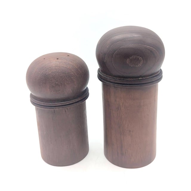 Offered is a Teak wood salt shaker and a pepper mill made in Denmark in the early 1970s, anddesigned by Gunnar Cyrén...