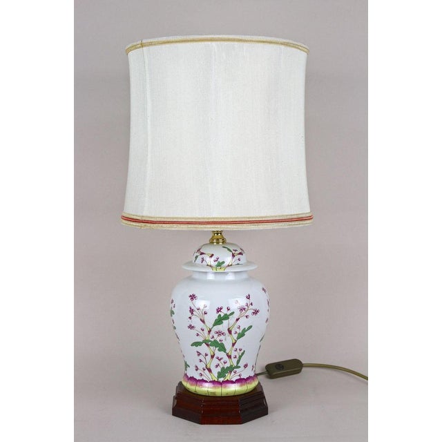 Lovely pair of late mid century modern Italian ceramic table lamps with lampshades from the 1970s. The beautifully...