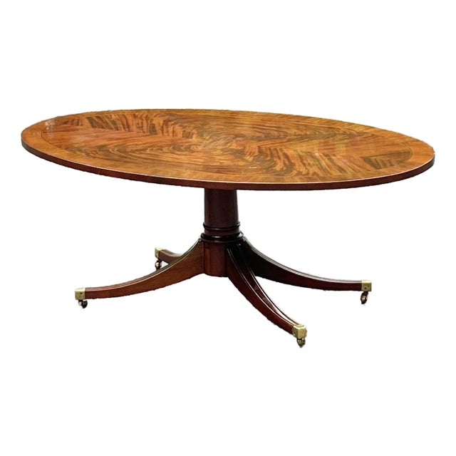 Regency Style Flame Mahogany Banded Oval Coffee Table For Sale