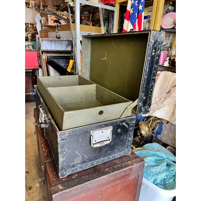 This wonderfully authentic mid-20th-century U.S. military footlocker trunk seamlessly blends historic character with...
